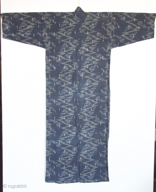 Japanese Kimono, very fine indigo color. I believe the fabric is ramie. It is an Ikat called Katsuri.  

Excellent condition even though it is old.  There is one patch which  ...