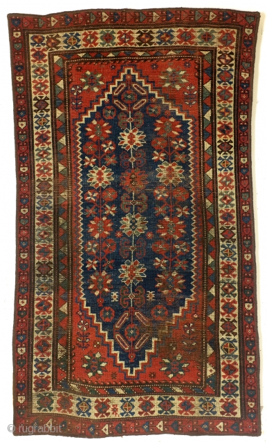 Shirvan, Caucasus, 100 years old,, 186 x 106 cm.
6.2 ft. x 3.5 ft. wool on wool knotted. Natural dye. Low pile, the edges festooned again.        