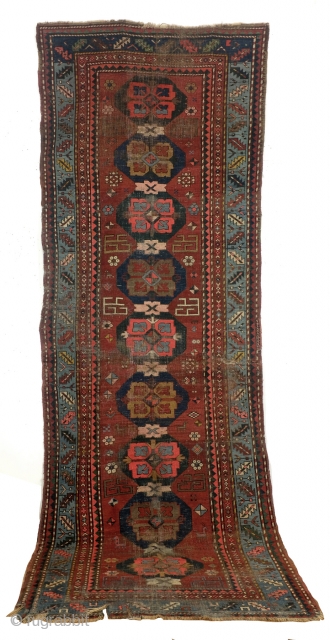 Armenian rug, antique,  with text. 
Zurvanist fire torch and fire symbol in the border. 
Wine glass and saw blade called. 
1900-1910. wool on wool. 
360 x 125 Cm. - 12 feet  ...