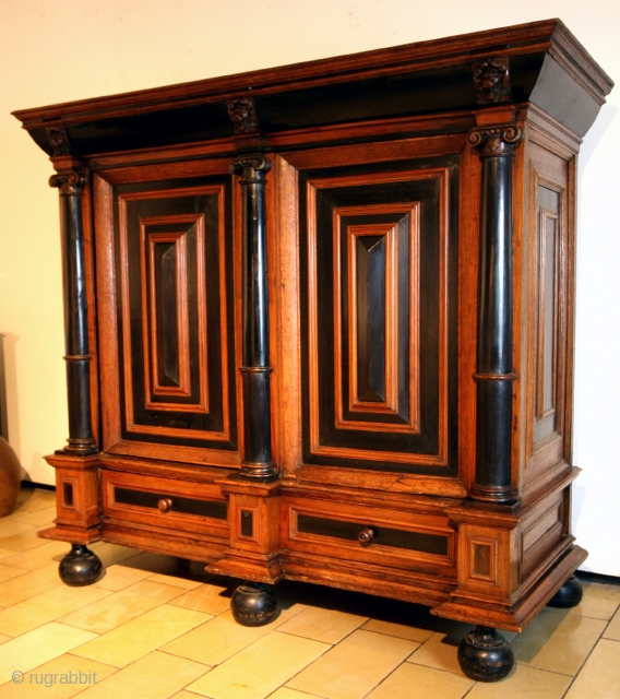 Fine Dutch 2nd half 17th century 'Kolommen kast'. 
Ebony and oak.
High 155 Cm. wide 174 Cm. Deep 66 Cm. 
The doors are 8 Cm. thick. The key is 15 Cm long!. 
Hidden  ...