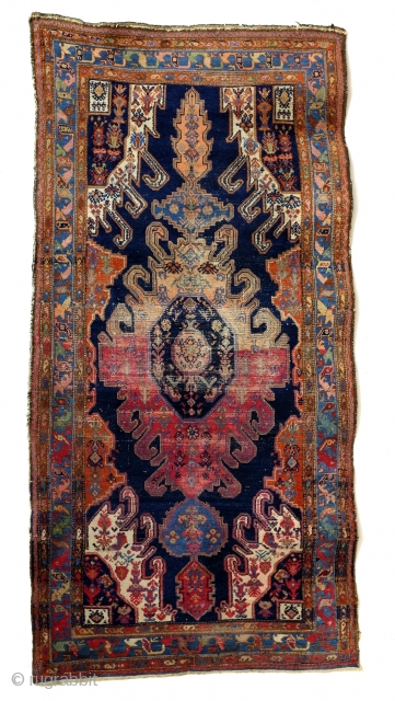 Hamadan area, early 20th century, 268 x 130 Cm. 
The design comes from the Caucasus, Gymil of Kabala. 

This rug became so special, in my eyes, because of the traces of age.  ...