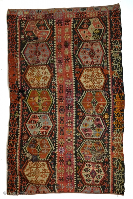 Kilim, Anatolia, fragment, as is, sewn on a protecting cloth at the back. 
280 x 167 Cm. old repairs.              