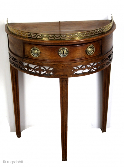 Demi Lune table, Louis XVI, 1775 - 1785, oak. 
High 72 Cm, Wide 52 Cm deep 32 Cm. 
              