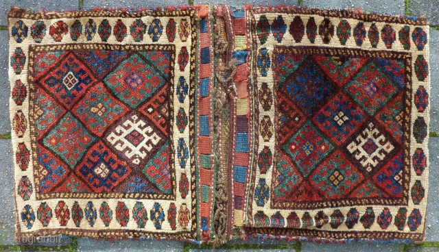 Antique Jaff Kurdish double bag, 112 x 63 cm.,end 19th c., good pile all over, some small repairs done, all natural dyes including a nice aubergine. Washed.      