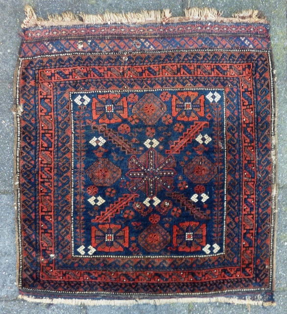 Baluch mina khani Bagface 19th. c., 81  x 74 cm., 32" x 29". With reasonable pile, a few silk knots and four finger thick seize holes. At the bottom kilim ending  ...