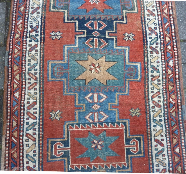 Antique NW-Persian/ Caucasian runner, 312  x 105 cm., 10'3" x 3'5" on woolen ground. With some wear and with all natural dyes. One older repair ( see pict. 3). Washed.  