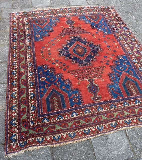 Afshar rug, ca. 1920, 211  x 161 cm., 6'11" x 5'3". In general good pile with original sides and endings. Corroded browns, a bit of lower pile at the central part  ...