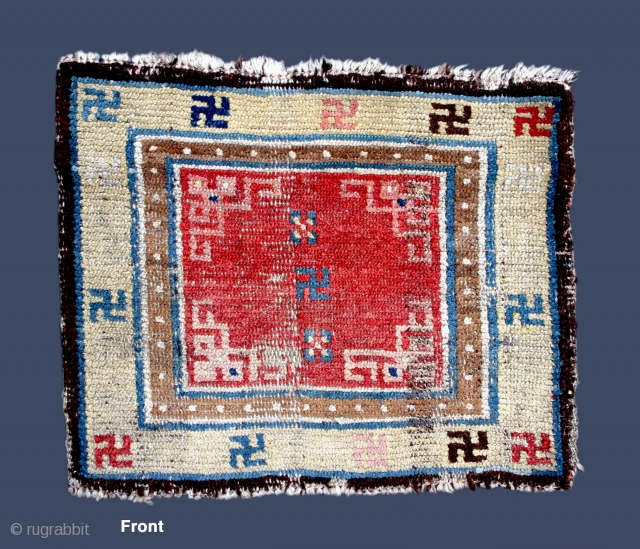 TC 17 - Tibetan Carpet
22 1/2”  X  19”
Small square w/ swastika
19th C.  ~  old & well used!
                