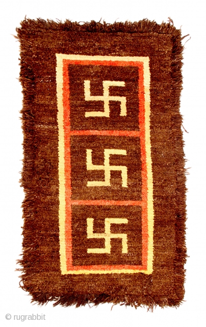 TC 20 - Warp-faced Back Carpet:

35”  x   62”
Tibet - 19th C.
Wool pile Khaden with yungdrung (swastika) design                