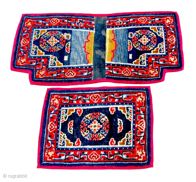 TIBETAN SADDLE CARPET SET (TC14)
Top - 30”  x  22” 
Bottom - 50 1/2”  x  52 3/4” 

Traditional Medallion design with borders bound with red corduroy cloth.
The notched carpet  ...