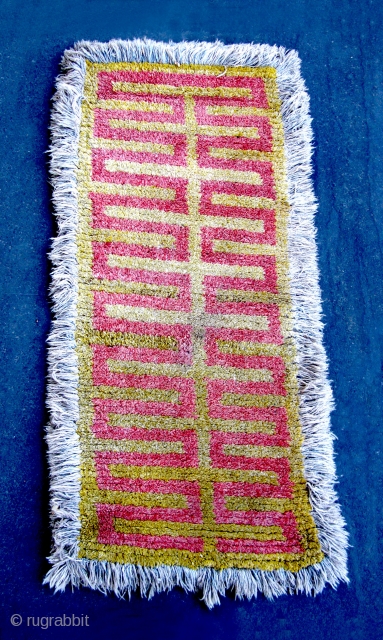 Tibet: Warp-faced Back Carpet (TC21)

80”  x   39”
19th c. Wool pile warp-faced back ‘Wangden’ - Yellow ground with Red key design.  The ’fringe' is a faded blue but otherwise  ...