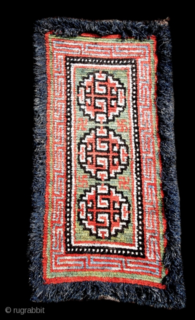 Warp Faced Back Tibetan Carpet  (TC07)

33”  x  66”   
Warp-faced back carpet, “Wangden” - Central Tibet.
Yak hair warp with wool pile Khaden and fringe borders.
Traditionally these were made  ...