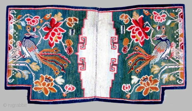 Tibetan Peacock Tahden (horse carpet) TC24

43”  x  23 3/4”
Graphic Peacock design on green ground.
Notched carpet goes on the horses back under the saddle.
Used but very good condition.  
Early ~  ...