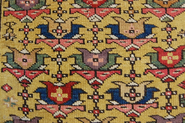 3' x 10' E. Caucasian rug, clear yellow ground with soft purple. Flat to the top, end slightly reduced, very small patch.           