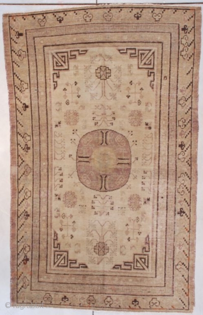 #7656 Khotan
This  Khotan measures 4’9” X 7’9” ( 149 x 240 cm). It has a center medallion in aubergine on a saffron ground with pomegranate motifs in the field and East   ...