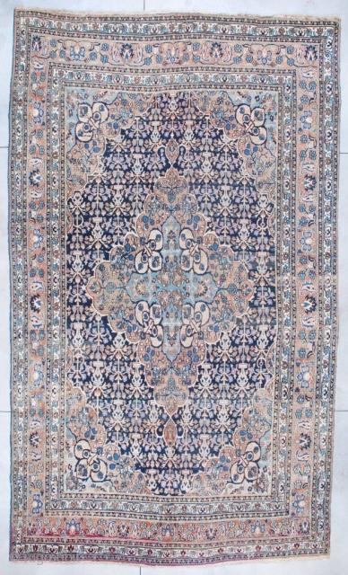 
#6942 Antique Khorassan Persian Rug
This circa 1880 Antique Khorassan Persian Oriental Carpet measures 10’1” X 17’3”. It has a large lobed pulled medallion with a sky blue center surrounded by peach, filled  ...