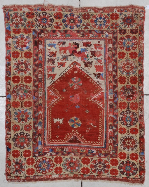 #7177 Melas Antique Turkish Rug
This circa 1825 Melas or Melez antique Oriental carpet measures 3’8” X 4’10”(115 x 152 cm). It has a tomato red prayer niche on an ivory ground with  ...