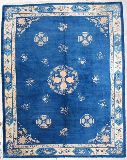 #7165 Antique Peking Chinese Rug 9’2″ X 11’8″
This Peking Chinese rug measures 9’2” X 11’8”. It has a medium blue field with a central medallion of four flowering urns coming together to  ...