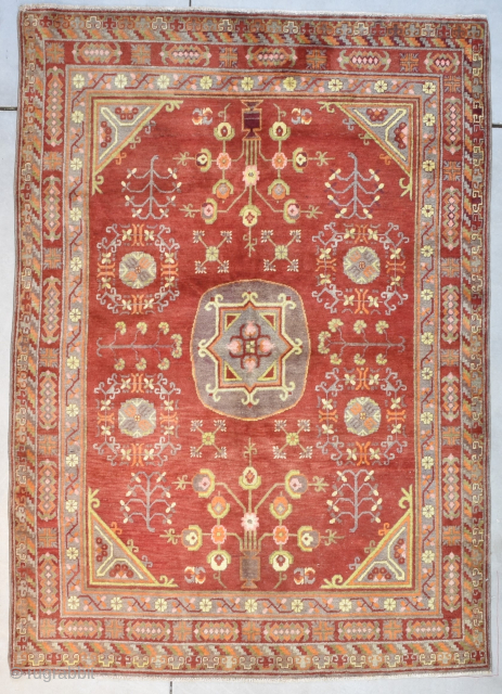 Vintage Khotan Oriental Rug 5’1” X 7’1” #8176
This circa 1920-1930 Khotan measures 5’1” X 7’1”. It has a single medallion containing a square and a flower and some hook figures on a  ...