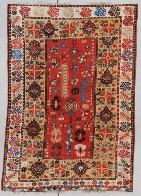 #7352 Antique Melas Turkish Rug
This 1st quarter 19th  century Melas or Melez antique Oriental rug measures 3’6” X 4’11” (109 X 155cm). It has a light rust or dark coral field  ...