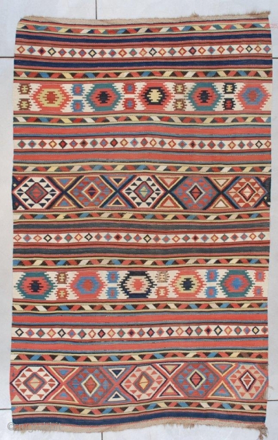 This 19th century Caucasian (Shirvan) Kilim measures 5’11” x 9’6” (179 x 292 cm). It is a beautifully drawn Caucasian kilim in striped motif with Memling guls, diamonds, triangles, stripes and solid  ...