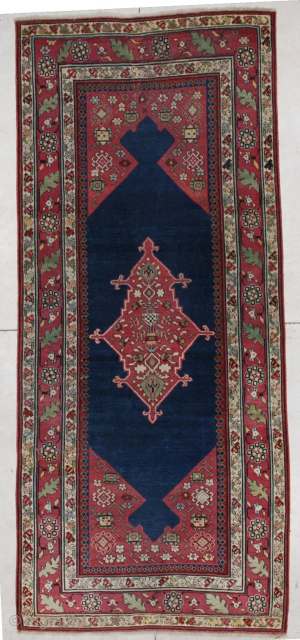 This Fabulous Classic Caucasian Karabaugh antique Oriental rug #5612 measures 4’0” X 9’4”. It is in essentially mint condition. It has a midnight blue field with maroon to aubergine corners and a ...