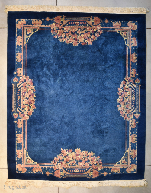 This circa 1935 vintage Peking Chinese Oriental Rug measures 8’5” X 9’9”. It has a medium blue field with a sculptured design and beautiful multi colored flowers coming from a garden planner  ...