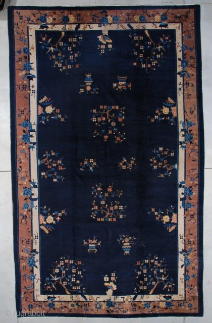 #7500 Antique Peking Chinese Rug 
This circa 1900 Peking Chinese Oriental rug measures 8’10” x 14’6” (273 x 444cm). It has a navy blue field with flower sprays in brown, rust, ivory  ...