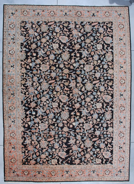 #7116 Antique Agra Rug from India
This third-quarter 19th-century Agra measures 11’1” x 15’3”. It has a black background with a vine and tendril design in   coral, very pale sky blue,  ...