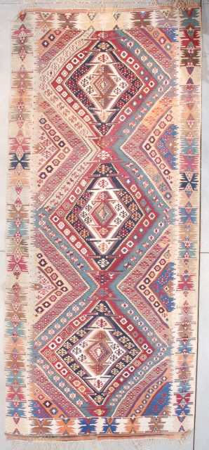 This beautiful mid to early 19th century Yoruk Kilim measures 5’10” x 13’4” (180 x 408 cm). It is woven as usual in two panels and put together. What is unusual is  ...