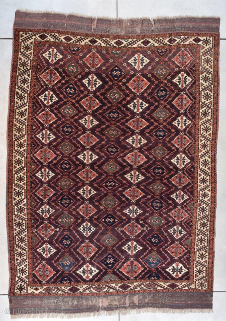 This circa 1820 Turkoman Chodor Oriental Rug #770 measures 6’8” x 9’3” (203 x 282 cm). It has a medium to dark chocolate brown field with a diamond shaped motif in pale  ...