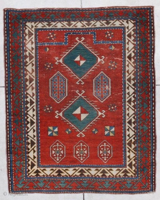 
 Borchalo Kazak Antique Caucasian Rug #6876
This first half 19th century Borchalo Kazak measures 3’10” X 4’9”. It is a lovely little prayer rug which has a tomato red field and a  ...
