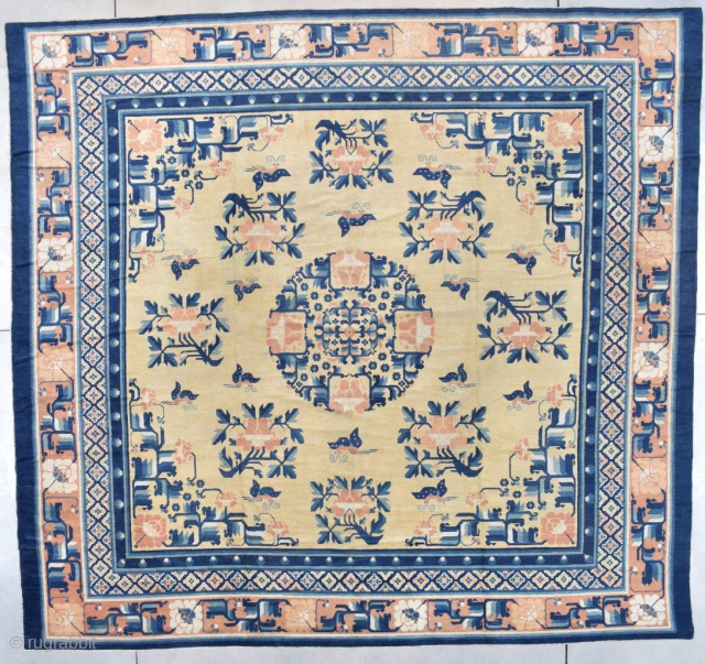 This pre 1850’s Ningxia Chinese Oriental rug #7256 measures a nearly square 12’3’ x 11’9” (374.9 x 362.71 cm). The field is the color of unsalted butter. It has a medallion composed  ...