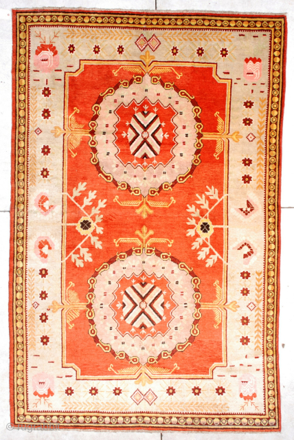 This circa 1880 Khotan antique Oriental Rug #6723 measures 5 ‘ 9” x 9’ 0 “. This fantastic carpet has a bittersweet field with two medallions which are drawn in a three  ...