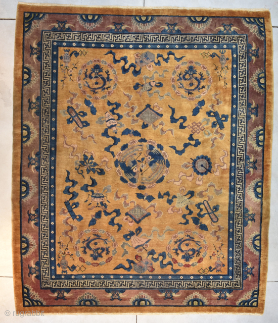 This circa 1920 handmade wool Art Deco Chinese Oriental Rug #8159 measures 8’0” X 9’10”. It has a golden yellow brown field and an extremely interesting layout. There is a dragon at  ...