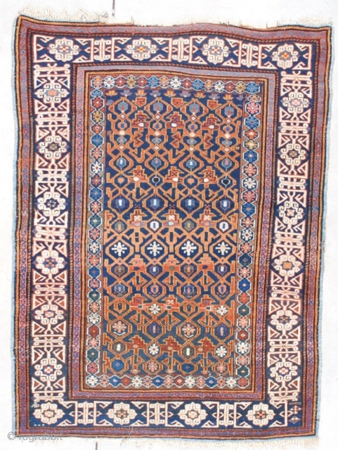 #7554 Kuba Antique Caucasian Rug 4’0″ X 5’3″
This circa 1870 Kuba measures 4’0” X 5’3” (121 x 161 cm). It has a blue ground with a combination latch hook and trellis design  ...