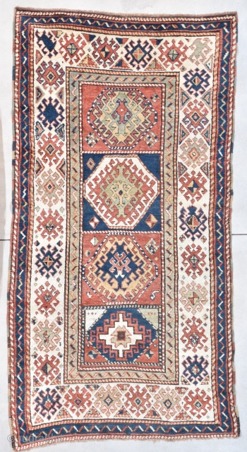 This circa 1880 Caucasian Kazak Oriental Rug #7997 measures 4’1” X 7’6”. It has four panels with a Memling gul in the center of each of the panels. Each is different. The  ...