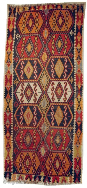 #6647 Turkish Kilim

This circa 1920 Turkish Kilim measures 4’11” X 11’4”. It is woven in two panels. It has eight hexagonal medallions in pumpkin, tomato red, ivory and brown on a brown  ...