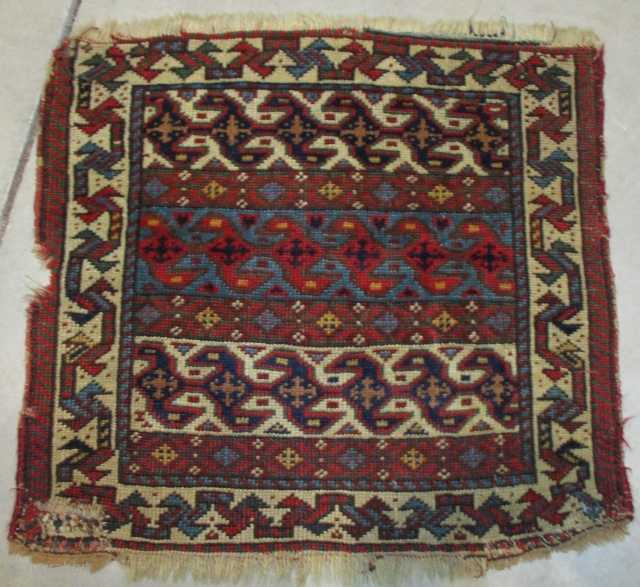 Antique Quashki Rug 1’8” X 1’9” #8093
This 19th century antique Quashki rug measures 1’8” X 1’9”. It has a three panel field consisting of Lazy ‘S’ design, one on an ivory ground  ...