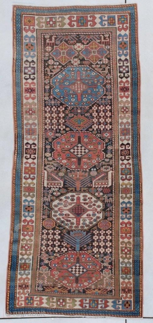 This mid 19th century Akstava antique Oriental Rug #7418 measures 3’1” x 7’2” (94 x 219 cm). It has a natural brown field containing four medallions; two in rust, one in ivory  ...