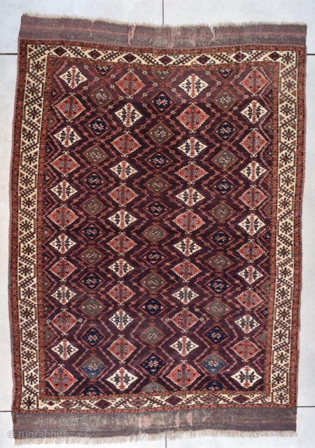 This circa 1820 Turkoman Chodor Oriental Rug #7770 measures 6’8” x 9’3” (203 x 282 cm). It has a medium to dark chocolate brown field with a diamond shaped motif in pale  ...