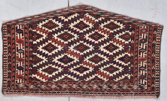 This late 19th century Yomud (Yomut) Asmalyk #8020 measures 1’2” X 3’6”. It has 6 ½ rows of trellis on a brown ground very reminiscent of Chodor. The border on three sides  ...