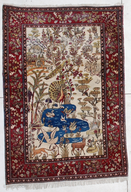 This circa 1880 Laver Kerman antique Persian Oriental Rug measures 4’6” X 6’5”. It has a hunting scene and a tree of life design on an ivory ground.
https://antiqueorientalrugs.com/product/6450-laver-kerman-persian-antique-rug/     