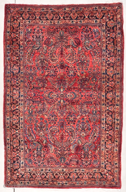 This circa 1920 Sarouk Persian Oriental Rug #7847 measures 4’4” X 6’8”. It is a deep ruby red with an overall floral design which is very crowded and very beautiful. The field  ...