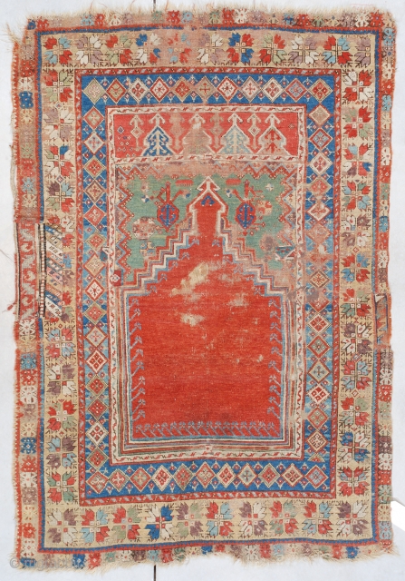 #7464 Mudjur

This probably 18th century, possibly older Mudjur (Mucur) measures 3’9” X 5’3” (118 x 161 cm). This little prayer rug displays beautiful colors. The tomato red step prayer field outlined in  ...