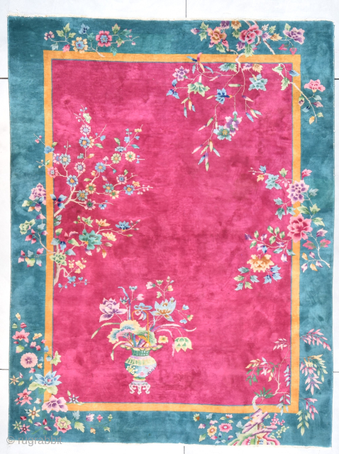 Art Deco Chinese Oriental Rug 9’0” X 11’8” #7996
This circa 1920 Art Deco Chinese Oriental Rug measures 9’0” X 11’8”. It has a hot ruby field with a three colored vase loaded  ...