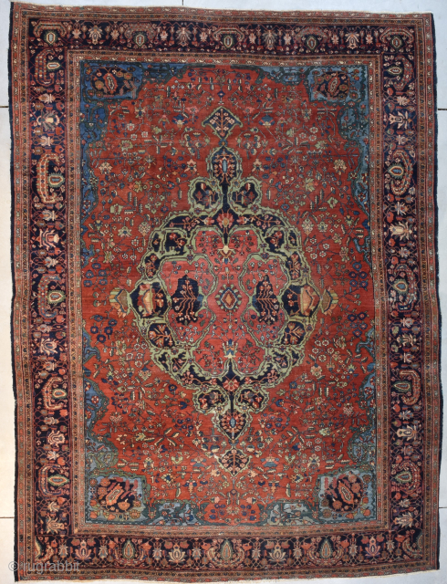 Antique Fereghan Sarouk 8’4” X 11’5” #8124 This last quarter 19th century Fereghan Sarouk measures 8’4” X 11’5”. It has a dark red floral motif field filled with a rose, green and  ...
