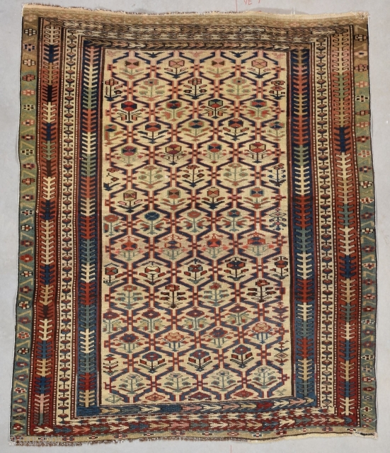 This circa 1880 Kuba #7739 antique rug measures 3’3” X 3’9” (100 x 117 cm). It is a cute little Kuba with a lattice design on an ivory ground. Each part of  ...