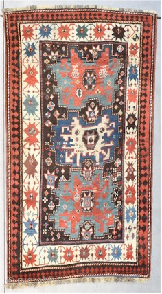 This third quarter 19th century Kazak Oriental rug #8199 measures 4‘3“ by 6‘5“. It has three Shirvan stars in the center, one blue with an ivory center flanked by two green stars ...