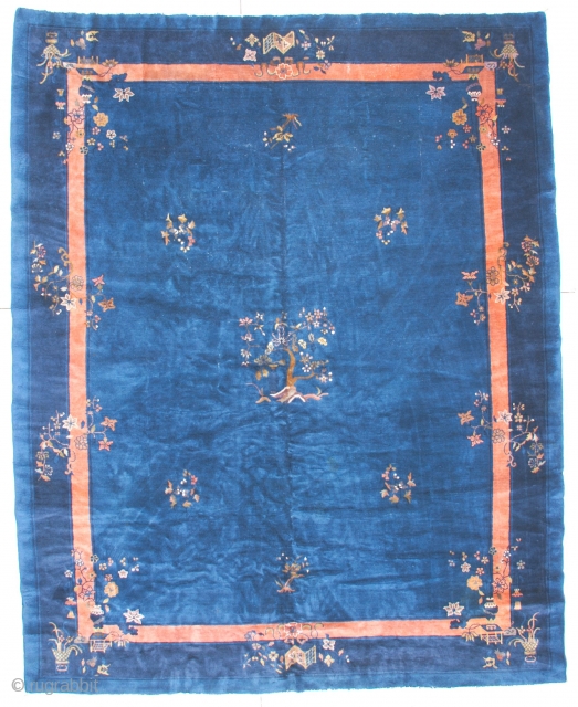 
#6258 Antique Feti Chinese
This circa 1910 Feti Chinese rug measures 9’2” X 11’5’. It has a medium blue field with a tree growing from a group of rocks in the center surrounded  ...